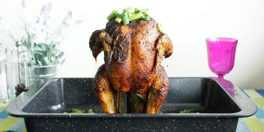 Chicken stood upright over a beer can