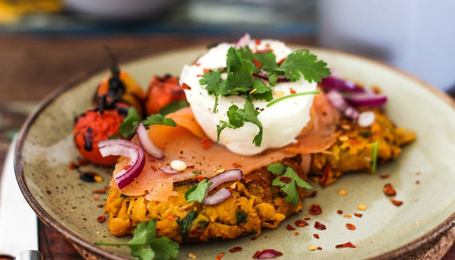 Vegetarian carrot and feta fritters topped with yoghurt