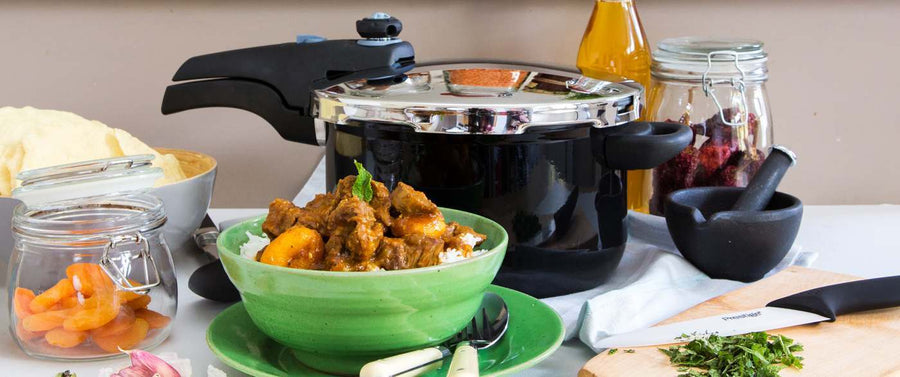 Lamb & Apricot curry in front of a Prestige pressure cooker