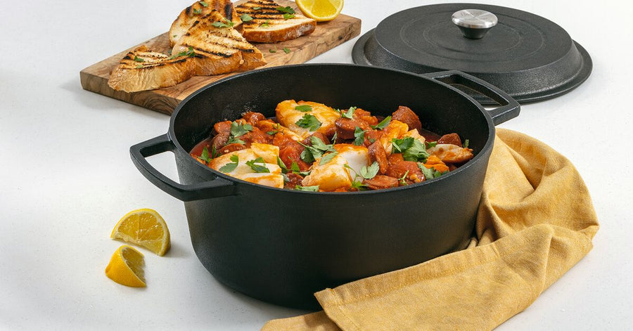 A chicken casserole in a cast iron casserole dish